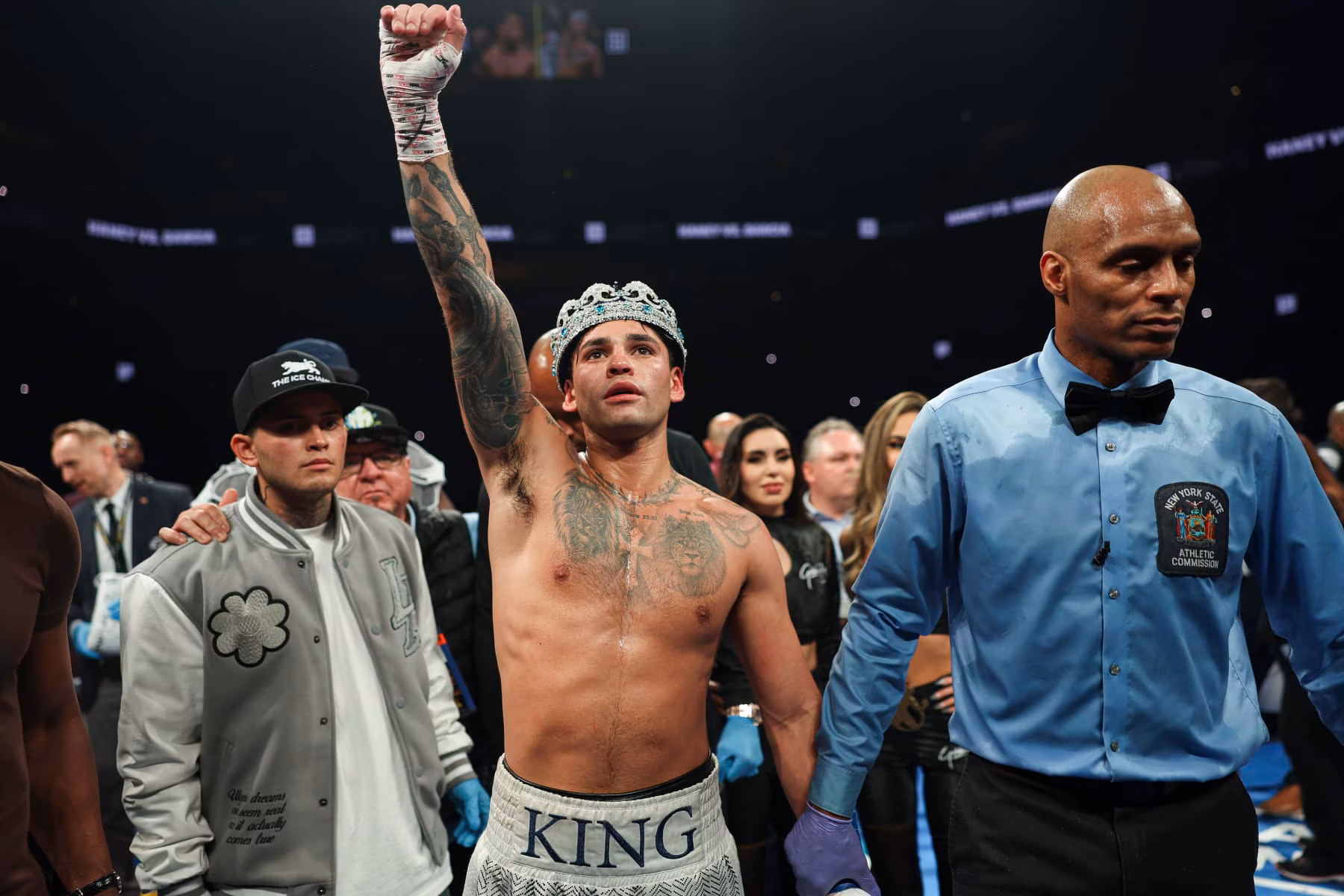 Ryan Garcia in the ring, ember rim light on shoulders